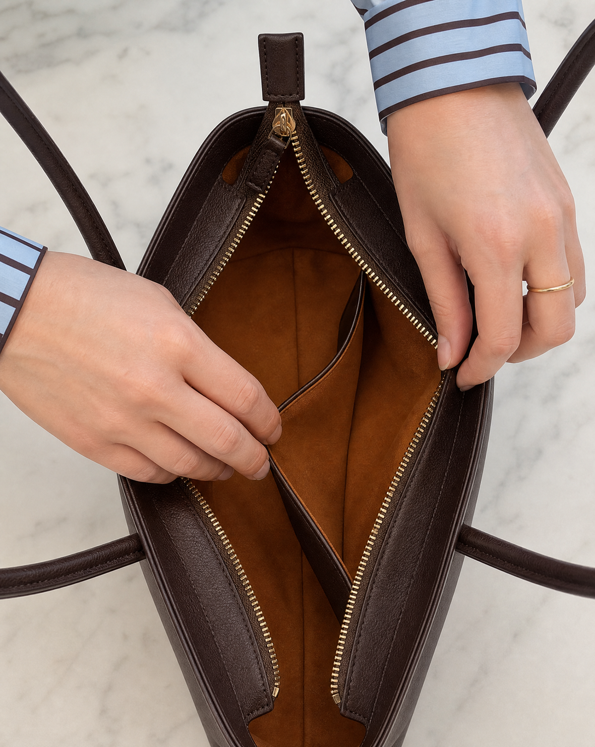 The Kells open from above, showing the interior pocket and the merlot lining